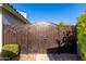 Ornate metal gate leading to the backyard at 9382 E Aster Dr, Scottsdale, AZ 85260