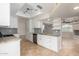 Well-equipped kitchen with granite counters and white cabinets at 9382 E Aster Dr, Scottsdale, AZ 85260