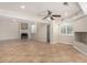 Open living room with tile floors and a fireplace at 9382 E Aster Dr, Scottsdale, AZ 85260