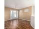Spacious living room with wood floors and access to a patio at 9382 E Aster Dr, Scottsdale, AZ 85260