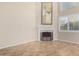 Bright living room with a fireplace and large windows at 9382 E Aster Dr, Scottsdale, AZ 85260