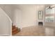 Living room with wooden staircase and high ceilings at 9382 E Aster Dr, Scottsdale, AZ 85260