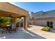 Covered patio with seating area, built-in grill, and ceiling fan at 9382 E Aster Dr, Scottsdale, AZ 85260