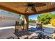 Patio dining area with ceiling fan, offering views of the pool at 9382 E Aster Dr, Scottsdale, AZ 85260