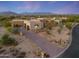 Modern home with a large driveway and desert landscaping at 9940 E Aleka Way, Scottsdale, AZ 85262