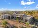 Luxury home with stone accents, a pool, and stunning mountain views at 9940 E Aleka Way, Scottsdale, AZ 85262