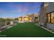 Landscaped backyard with putting green and mountain views at 9940 E Aleka Way, Scottsdale, AZ 85262