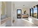 Bright bathroom with a soaking tub and contemporary fixtures at 9940 E Aleka Way, Scottsdale, AZ 85262