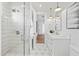 Modern bathroom with a walk-in shower, patterned tile floor, and white vanity at 9940 E Aleka Way, Scottsdale, AZ 85262