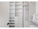 Large walk-in closet with ample shelving and drawers at 9940 E Aleka Way, Scottsdale, AZ 85262