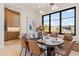 Spacious dining area with wood cabinets, a built-in bench, and large windows offering scenic views at 9940 E Aleka Way, Scottsdale, AZ 85262
