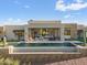 Contemporary home exterior with a large pool and scenic views at 9940 E Aleka Way, Scottsdale, AZ 85262
