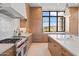 Modern kitchen with island and high-end appliances at 9940 E Aleka Way, Scottsdale, AZ 85262