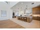 Modern kitchen boasts a large island, custom cabinetry, and high-end appliances at 9940 E Aleka Way, Scottsdale, AZ 85262