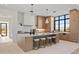 Open concept kitchen with breakfast bar and stunning views from large windows at 9940 E Aleka Way, Scottsdale, AZ 85262