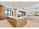 Open kitchen with large island and built in oven at 9940 E Aleka Way, Scottsdale, AZ 85262