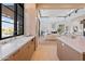 Open kitchen with breakfast bar and views of the living room at 9940 E Aleka Way, Scottsdale, AZ 85262