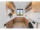 Bright laundry room with modern appliances and ample storage space at 9940 E Aleka Way, Scottsdale, AZ 85262