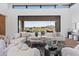Open concept living room with access to pool and mountain views at 9940 E Aleka Way, Scottsdale, AZ 85262