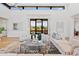 Open living room with large windows, high ceilings, and modern decor at 9940 E Aleka Way, Scottsdale, AZ 85262
