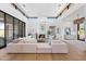 Bright living room with high ceilings, fireplace, and large windows at 9940 E Aleka Way, Scottsdale, AZ 85262