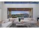 Living room with stunning sunset views and comfortable seating at 9940 E Aleka Way, Scottsdale, AZ 85262