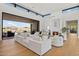 Spacious living area with fireplace, large windows, and access to backyard at 9940 E Aleka Way, Scottsdale, AZ 85262