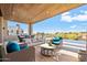 Inviting pool area with seating, wood pergola and scenic view at 9940 E Aleka Way, Scottsdale, AZ 85262