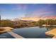 Infinity pool with mountain and sunset views at 9940 E Aleka Way, Scottsdale, AZ 85262