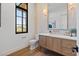 Modern powder room with floating vanity and stone wall at 9940 E Aleka Way, Scottsdale, AZ 85262