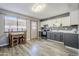 Modern kitchen with gray and white cabinets and wood-look floors at 12846 N 113Th Ave # 4, Youngtown, AZ 85363