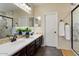 Elegant bathroom with double vanity, large shower, and marble flooring at 12964 W Plum Rd, Peoria, AZ 85383