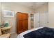 Spacious bedroom with a large wooden wardrobe at 12964 W Plum Rd, Peoria, AZ 85383