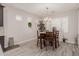 Bright dining room with wood table and chairs, and large window at 19606 W Grant St, Buckeye, AZ 85326