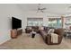 Living room featuring a sectional sofa and large TV at 22274 E Cherrywood --, Queen Creek, AZ 85142