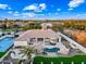 Backyard oasis with a pool, spa, sports court, and expansive lawn at 2335 E Plum St, Gilbert, AZ 85298