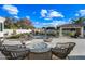 Fire pit surrounded by wicker chairs near the pool at 2335 E Plum St, Gilbert, AZ 85298