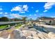 Resort-style backyard with pool, waterfall, and outdoor kitchen at 2335 E Plum St, Gilbert, AZ 85298