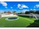 Turf backyard with trampoline and soccer goal at 2335 E Plum St, Gilbert, AZ 85298