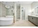 Luxurious bathroom with a soaking tub, large shower, and dual vanities at 2335 E Plum St, Gilbert, AZ 85298
