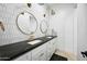 Modern bathroom with hexagon tile, double vanity, and gold fixtures at 2335 E Plum St, Gilbert, AZ 85298