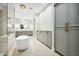 Elegant bathroom with freestanding tub and gray cabinetry at 2335 E Plum St, Gilbert, AZ 85298