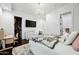 Spacious bedroom with large TV, walk-in closet, and plenty of light at 2335 E Plum St, Gilbert, AZ 85298