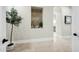 Transitional hallway with a niche and view into another room at 2335 E Plum St, Gilbert, AZ 85298