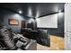 Home theater with comfortable seating and large projection screen at 2335 E Plum St, Gilbert, AZ 85298