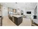 Open concept kitchen with large island, farmhouse sink, and stainless steel appliances at 2335 E Plum St, Gilbert, AZ 85298