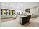 Open kitchen with island, stainless appliances, and breakfast bar at 2335 E Plum St, Gilbert, AZ 85298