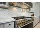 Luxury kitchen with stainless steel appliances and custom cabinetry at 2335 E Plum St, Gilbert, AZ 85298