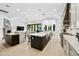 Spacious kitchen with a large island, stainless steel appliances, and views to the living room at 2335 E Plum St, Gilbert, AZ 85298