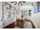 Home office with built-in shelving, a desk, and natural light at 2335 E Plum St, Gilbert, AZ 85298